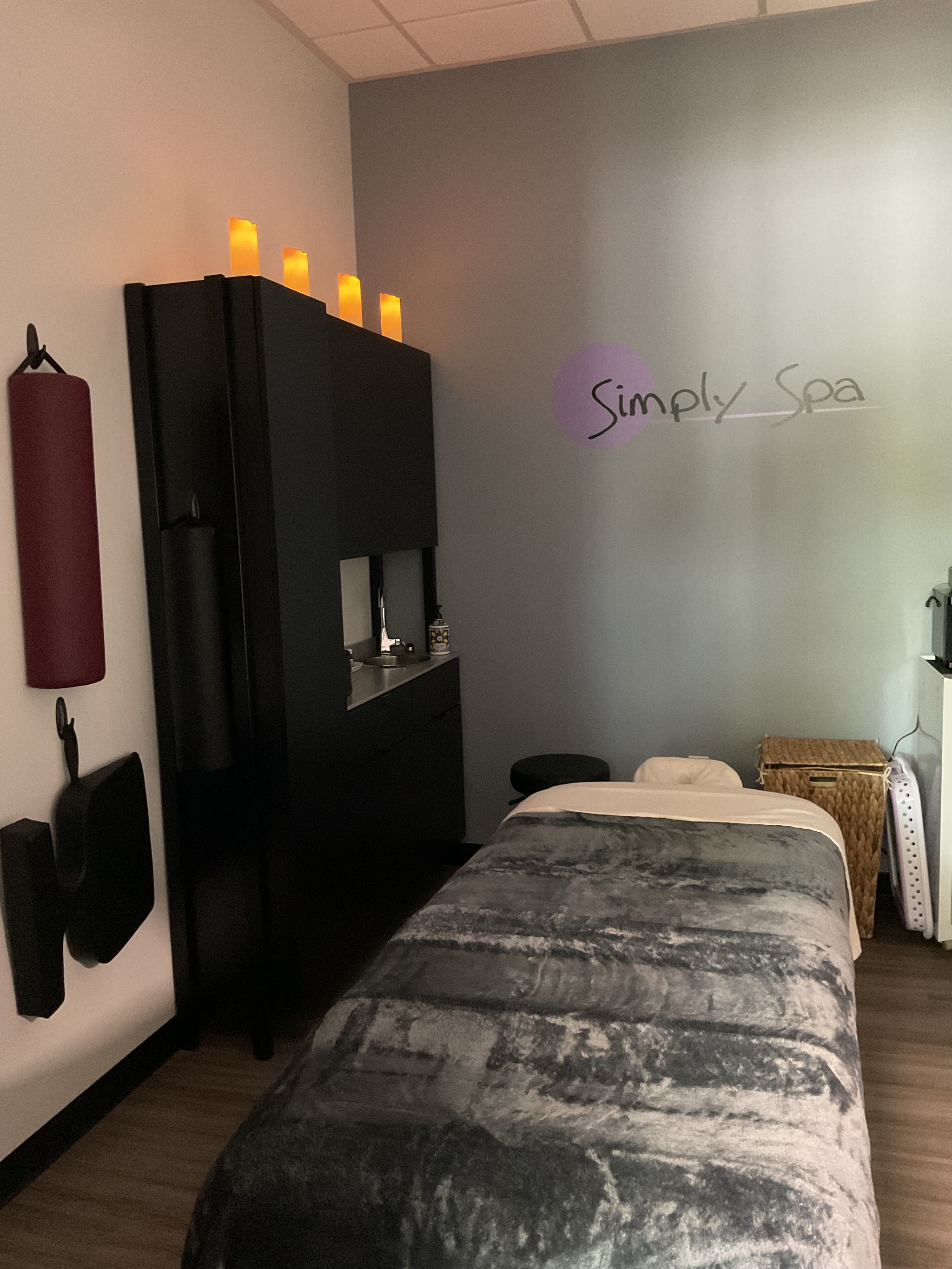 My treatment room, with a massage table and candlelight